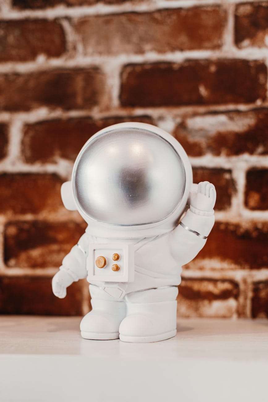 white astronaut toy on the table