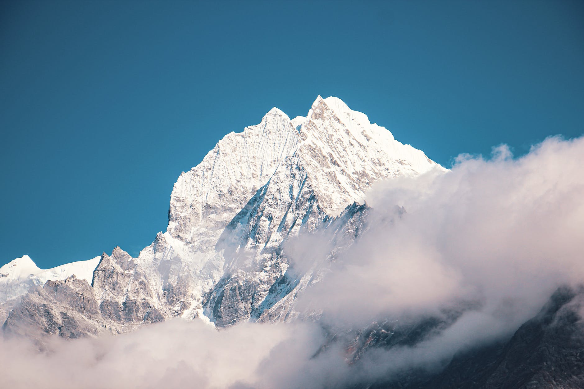 snow covered mountain under blue sky